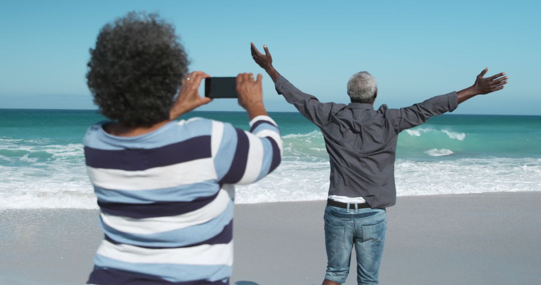 Senior Couple Enjoying Beachside Vacation - Free Images, Stock Photos and Pictures on Pikwizard.com