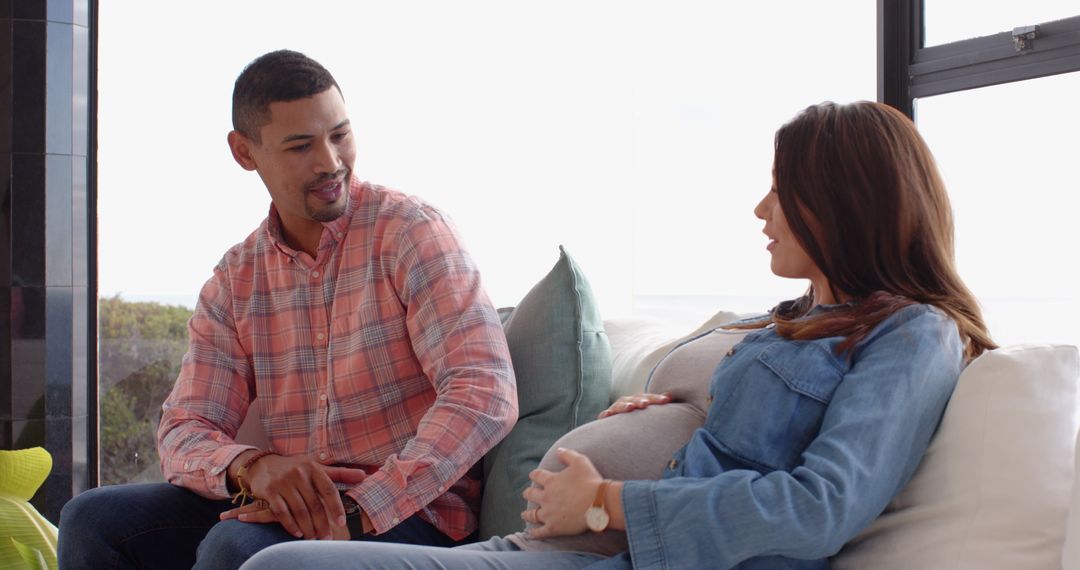 Pregnant Couple Relaxing Together at Home