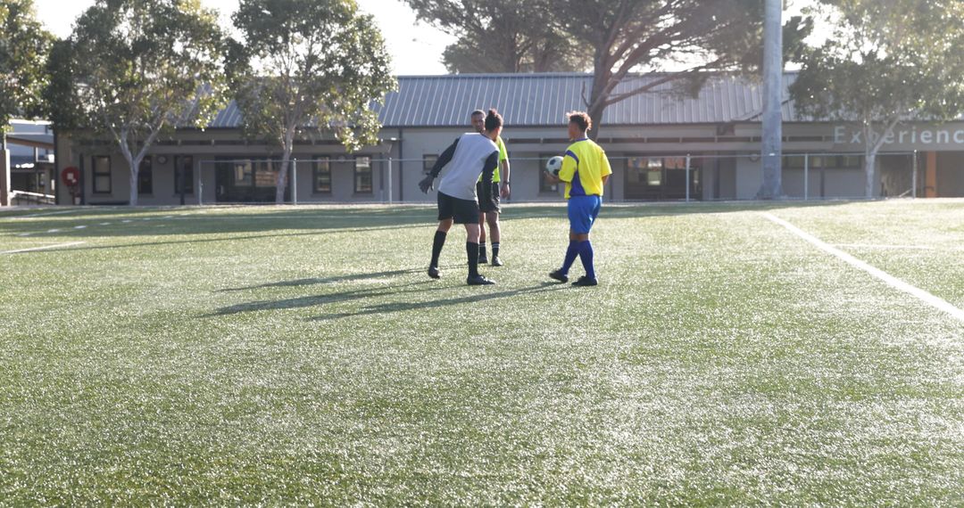 Youth Soccer Players Developing Teamwork on Sunny Field