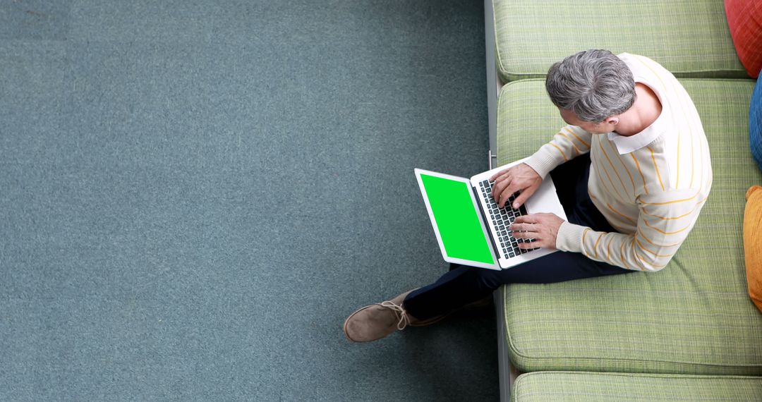 Mature Man Working on Laptop with Green Screen in Modern Office - Free Images, Stock Photos and Pictures on Pikwizard.com