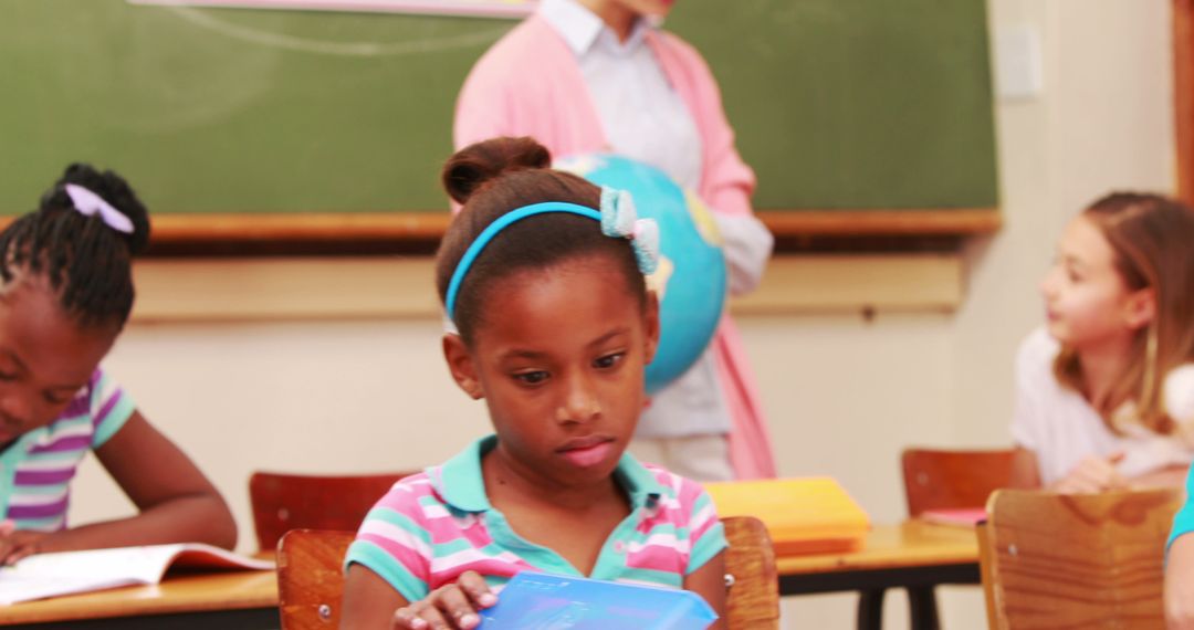 Focused African American Girl Studying in Classroom - Free Images, Stock Photos and Pictures on Pikwizard.com