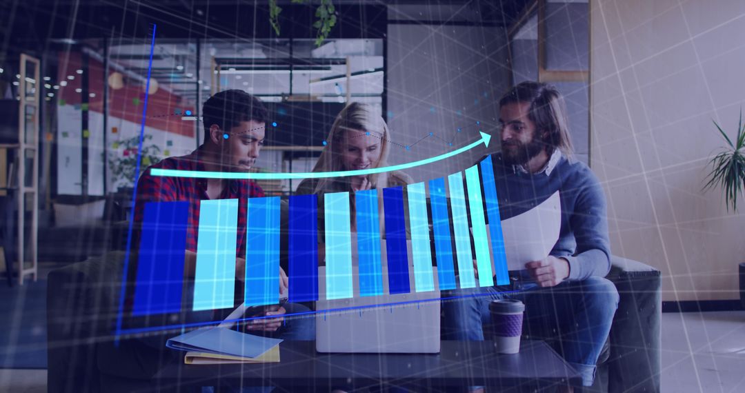 Diverse Team Analyzing Financial Data with Projected Graph Overlay in Modern Office - Free Images, Stock Photos and Pictures on Pikwizard.com