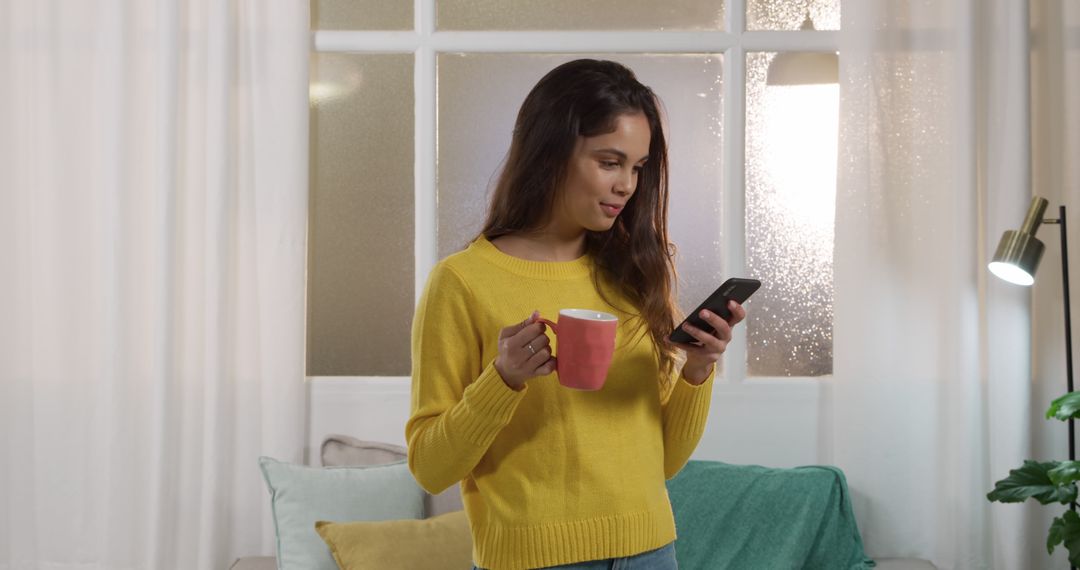 Woman Drinking Coffee While Using Smartphone at Home - Free Images, Stock Photos and Pictures on Pikwizard.com