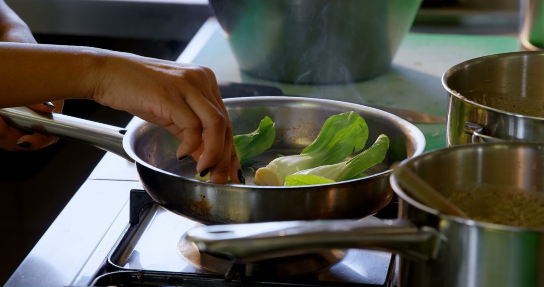 Chef Sautéing Fresh Vegetables in Professional Kitchen - Free Images, Stock Photos and Pictures on Pikwizard.com