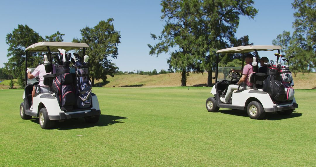 Golfers Driving Carts on Sunny Green Golf Course - Free Images, Stock Photos and Pictures on Pikwizard.com