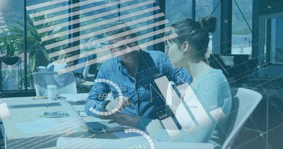 Business Team Collaborating Over Data Dashboards and Analytics on Laptop in Modern Office