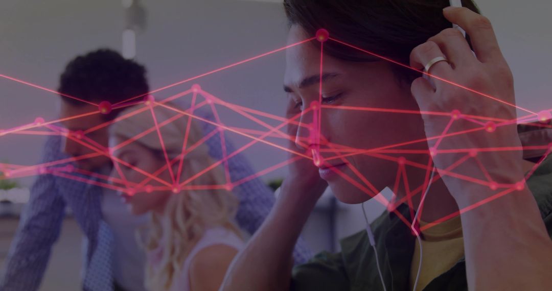 Focused Man Adjusting Headphones with Digital Network Overlay in Office