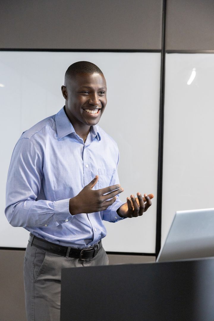 Smiling Professional Presenting Ideas in Modern Office Setting