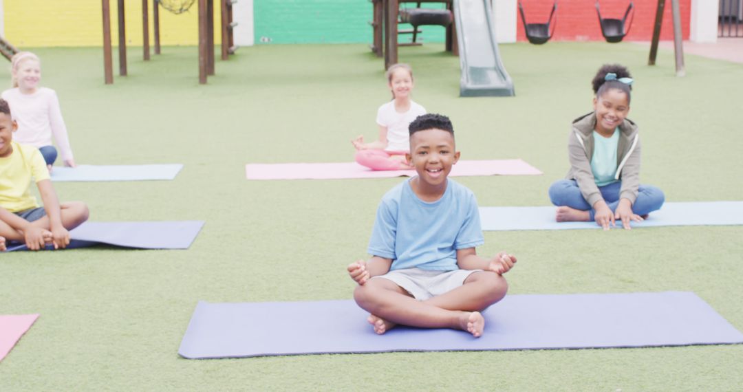 Diverse Group Of Children Practicing Yoga On Mats Outdoors - Free Images, Stock Photos and Pictures on Pikwizard.com