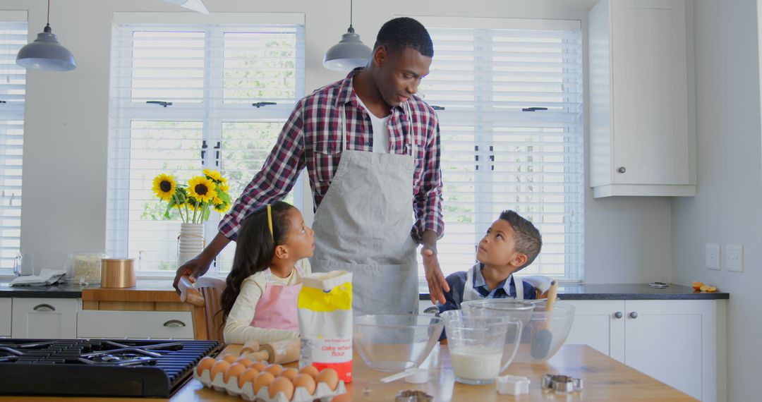 Father Baking with His Children in Modern Kitchen - Free Images, Stock Photos and Pictures on Pikwizard.com