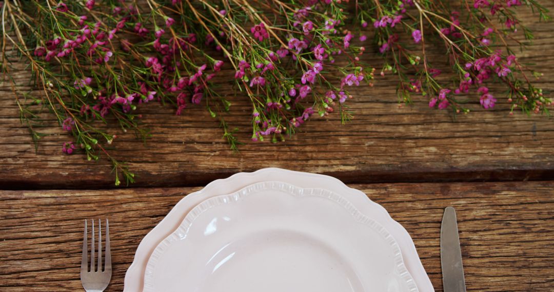 Rustic Table Setting with Pink Flowers and White Plate - Free Images, Stock Photos and Pictures on Pikwizard.com