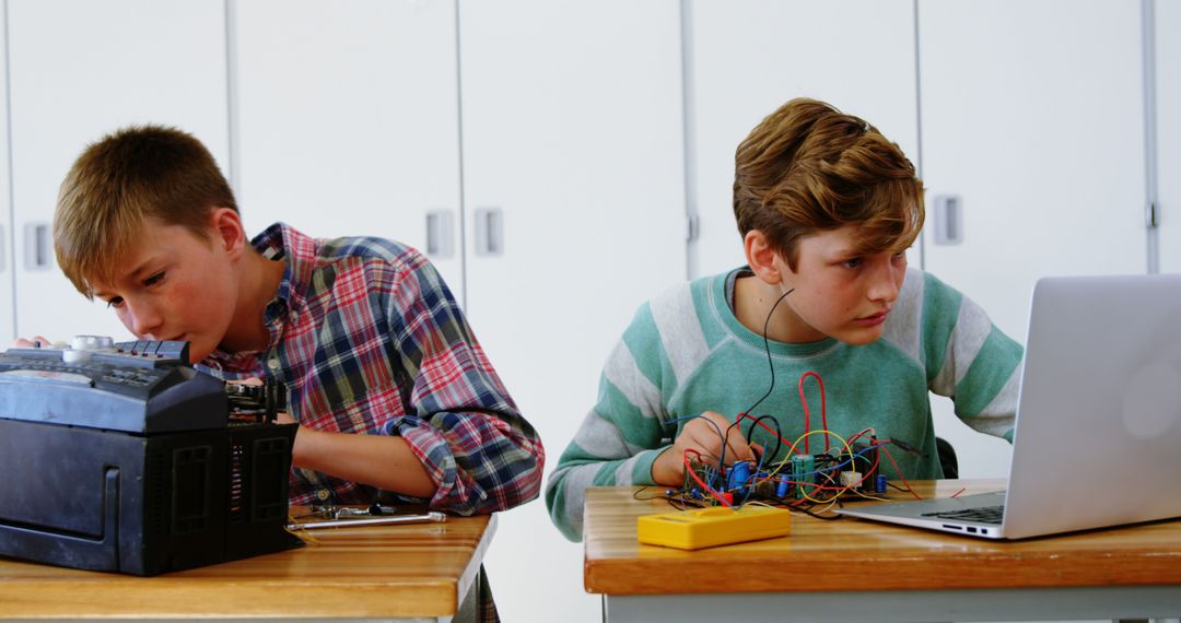 Two Teenage Boys Creating Electronics Projects in Classroom - Free Images, Stock Photos and Pictures on Pikwizard.com