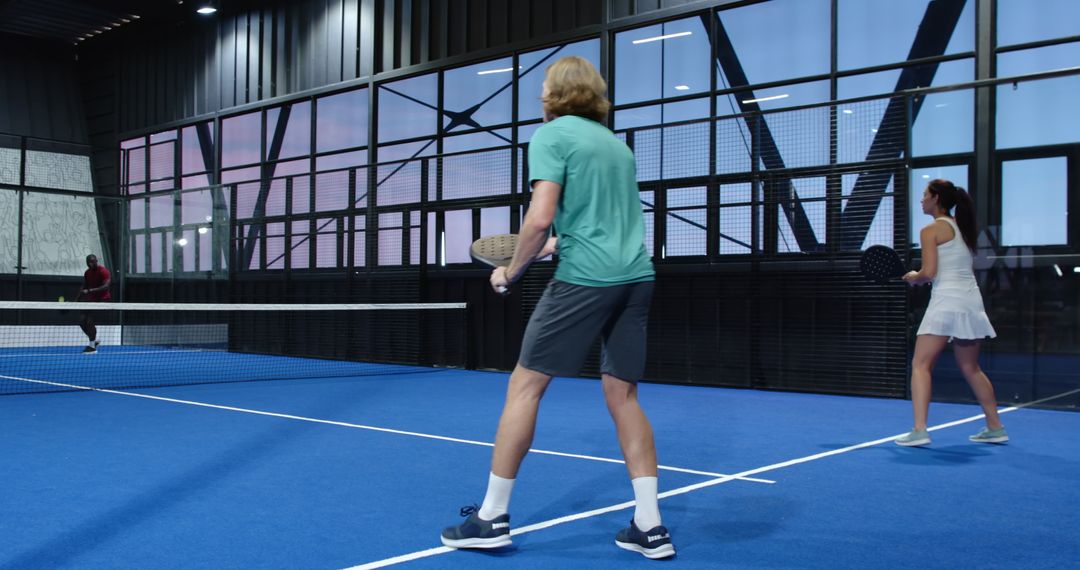 Dynamic Padel Match Inside Modern Indoor Court