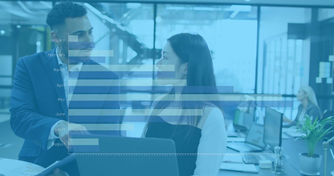 Confident Colleagues Analyzing Graphs in Modern Office Space