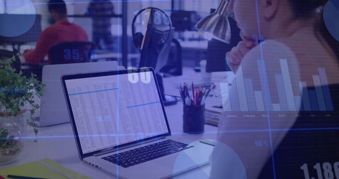 Businesswoman Analyzing Financial Data on Laptop with Graphs Overlay