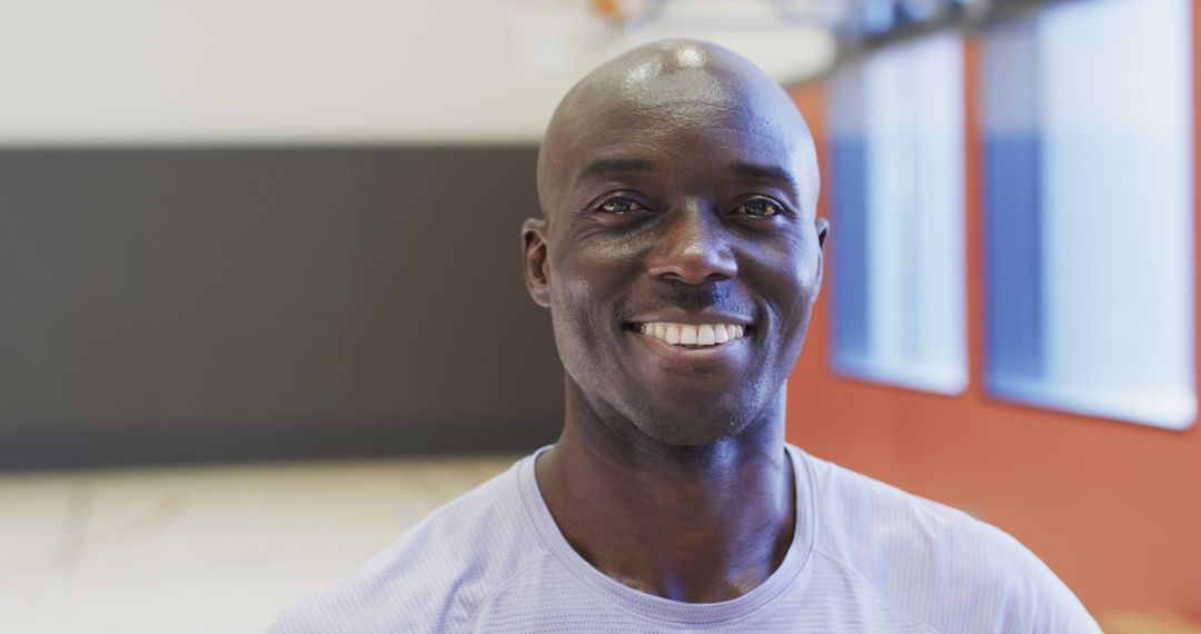 Smiling Athletic African American Man in Sports Facility - Free Images, Stock Photos and Pictures on Pikwizard.com