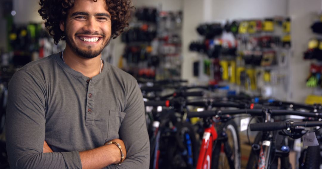 Confident Male Bicycle Store Owner Smiling in Front of Bikes - Free Images, Stock Photos and Pictures on Pikwizard.com