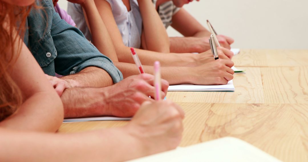 Group of Students Writing Notes in Classroom - Free Images, Stock Photos and Pictures on Pikwizard.com