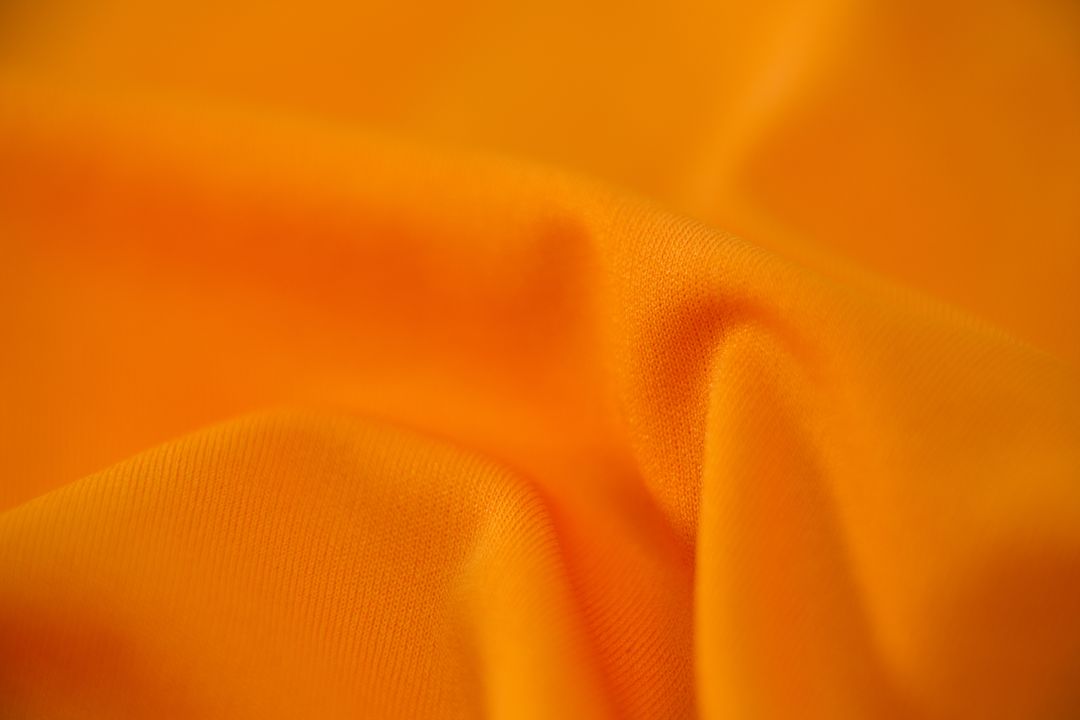 Close-Up of Vibrant Orange Fabric Texture - Free Images, Stock Photos and Pictures on Pikwizard.com