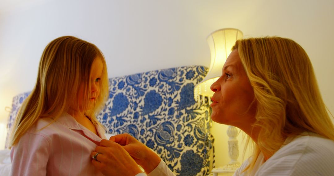 Mother Helping Daughter Get Ready in Cozy Bedroom - Free Images, Stock Photos and Pictures on Pikwizard.com