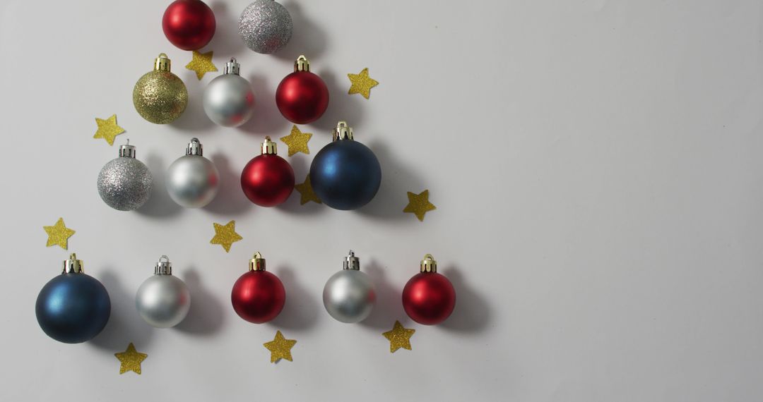 Christmas Tree Shape Made of Colorful Baubles and Stars on White Background - Free Images, Stock Photos and Pictures on Pikwizard.com