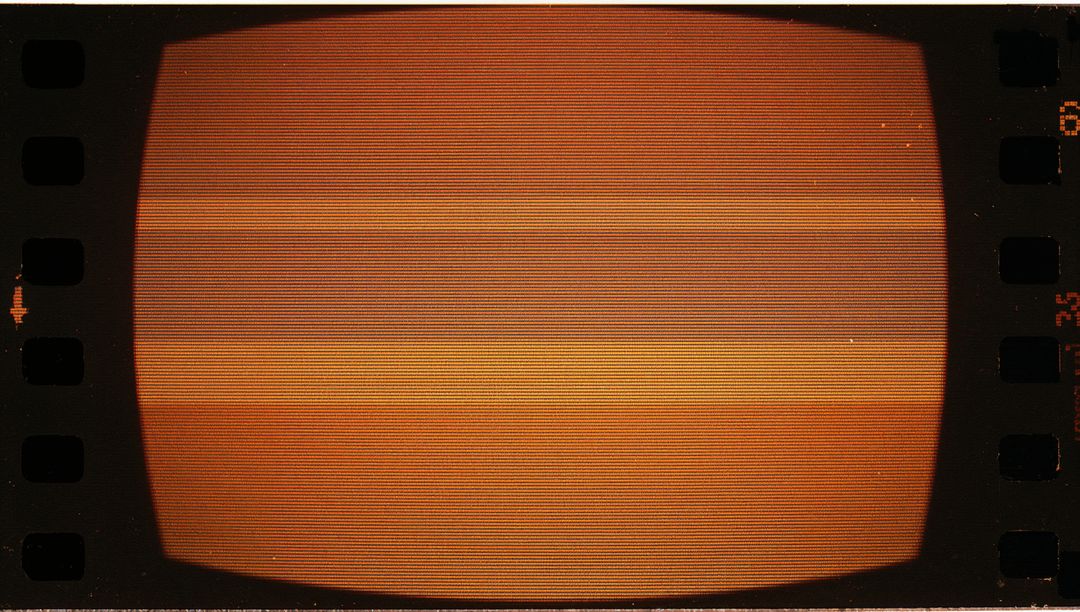 Orange Glow Vintage CRT Monitor Inside Editing Room with Film Strip