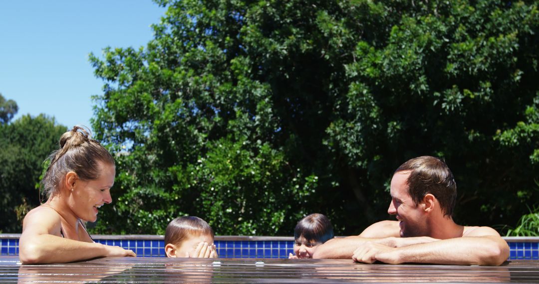 Family Enjoying Refreshing Pool Time Outdoors - Free Images, Stock Photos and Pictures on Pikwizard.com