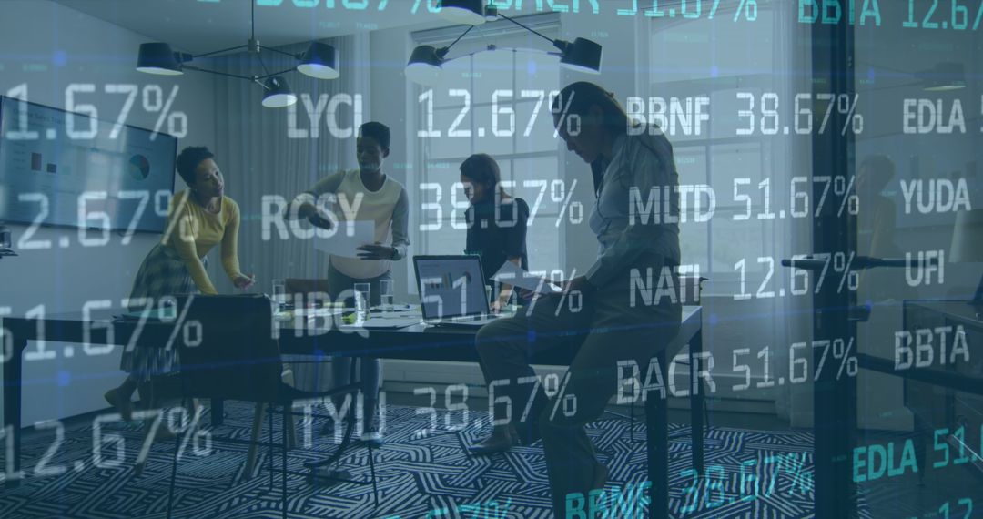 Diverse Team Engaged in Data Analysis Meeting in Modern Office