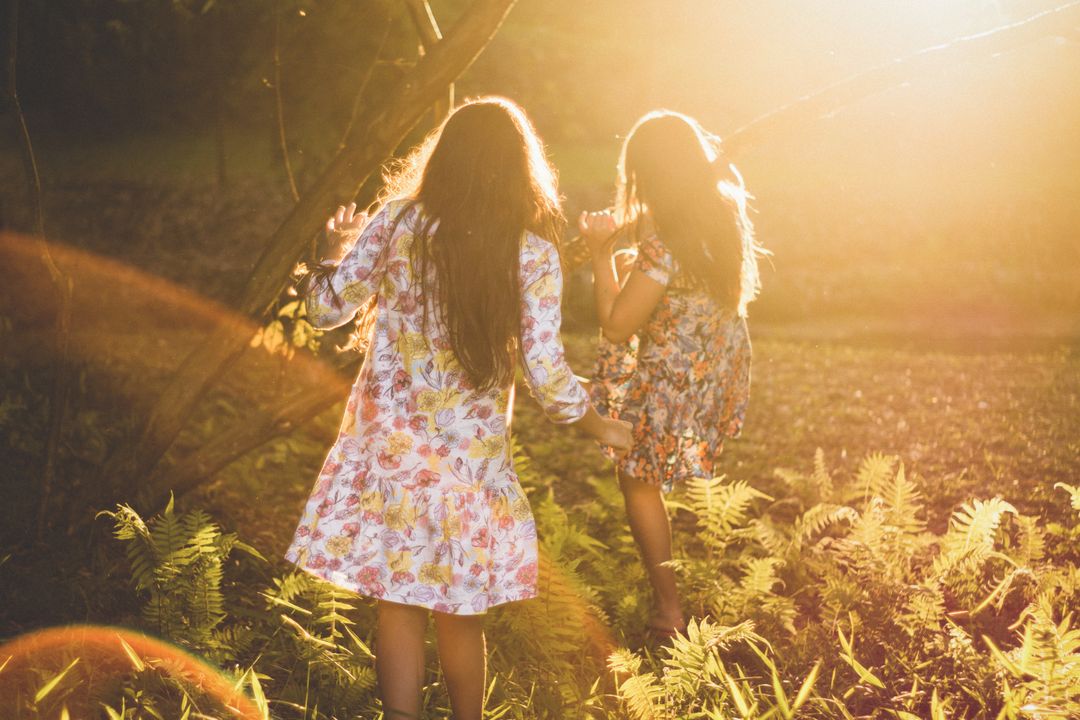 Children Exploring Forest in Golden Sunset