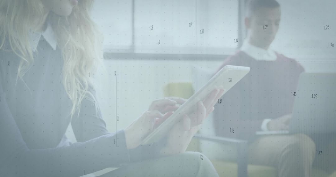 Professionals Engaging with Technology in Modern Office Lounge