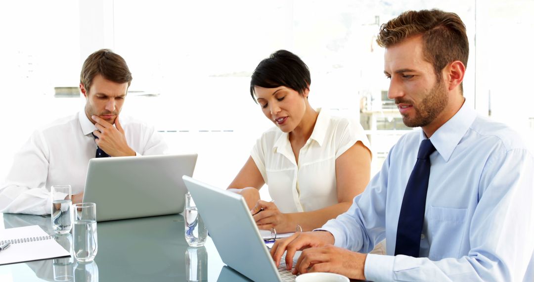 Group of Professionals Collaborating in Modern Office Space
