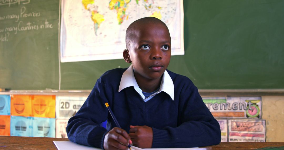 Young African Student Focusing on Study in Classroom - Free Images, Stock Photos and Pictures on Pikwizard.com