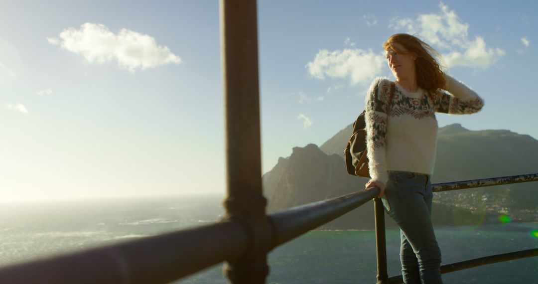 Woman Enjoying Scenic Mountain and Sea View from Lookout Point - Free Images, Stock Photos and Pictures on Pikwizard.com