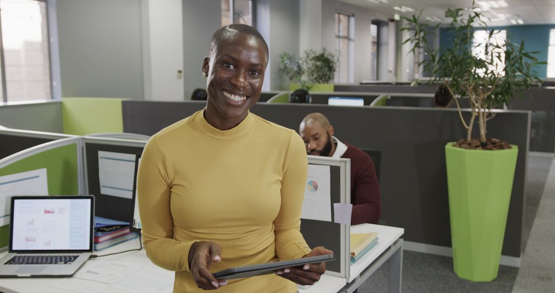 Happy Businesswoman Holding Digital Tablet in Modern Office - Free Images, Stock Photos and Pictures on Pikwizard.com