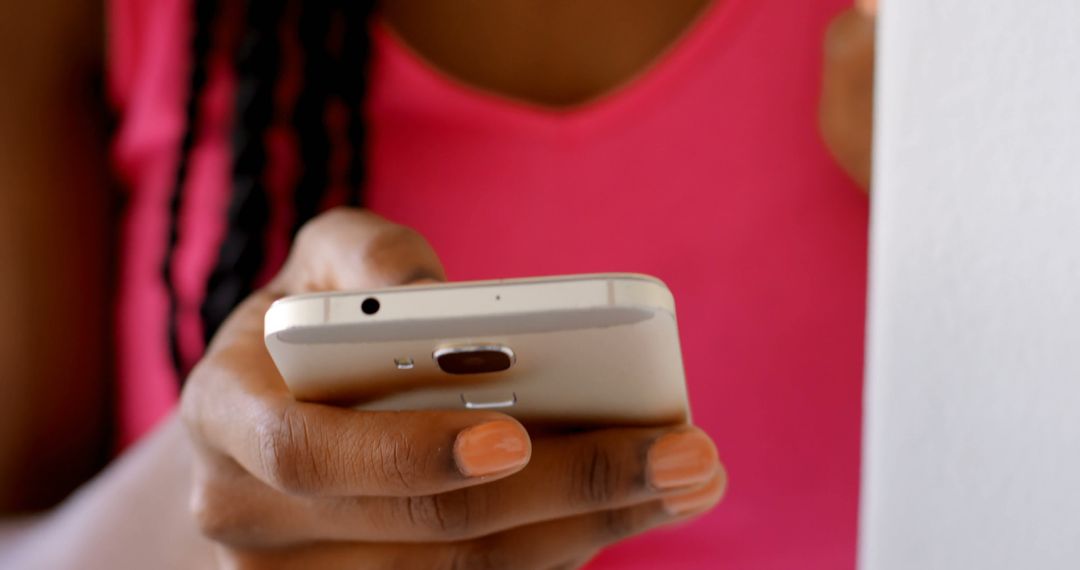 Close-up of Woman using Smartphone with Braided Hair and Pink Top - Free Images, Stock Photos and Pictures on Pikwizard.com