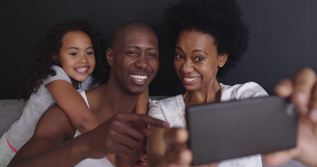 Smiling Family Taking Selfie Together at Home - Free Images, Stock Photos and Pictures on Pikwizard.com