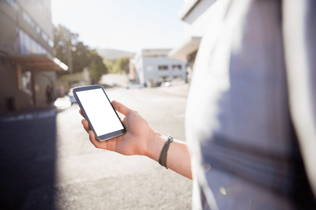 Casual Man Holding Transparent Smartphone in Urban Street Setting