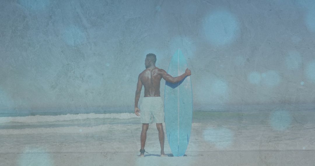 Surfer Holding Surfboard on Tranquil Beach Preparing for Adventure
