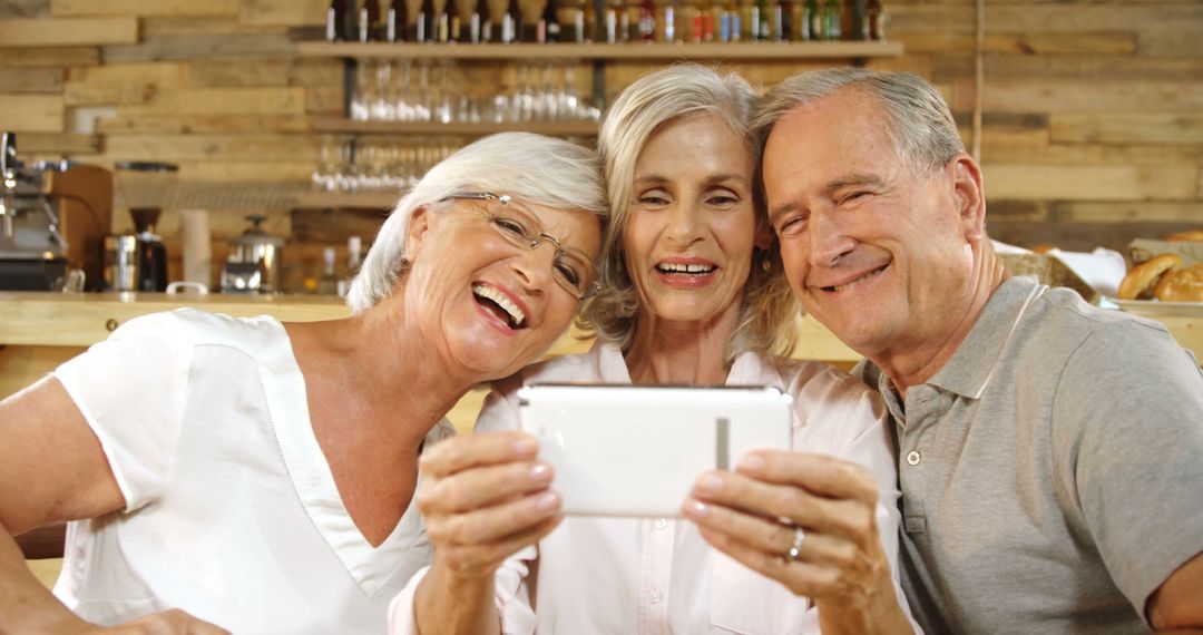 Happy Senior Friends Taking Selfie in Cozy Cafe - Free Images, Stock Photos and Pictures on Pikwizard.com