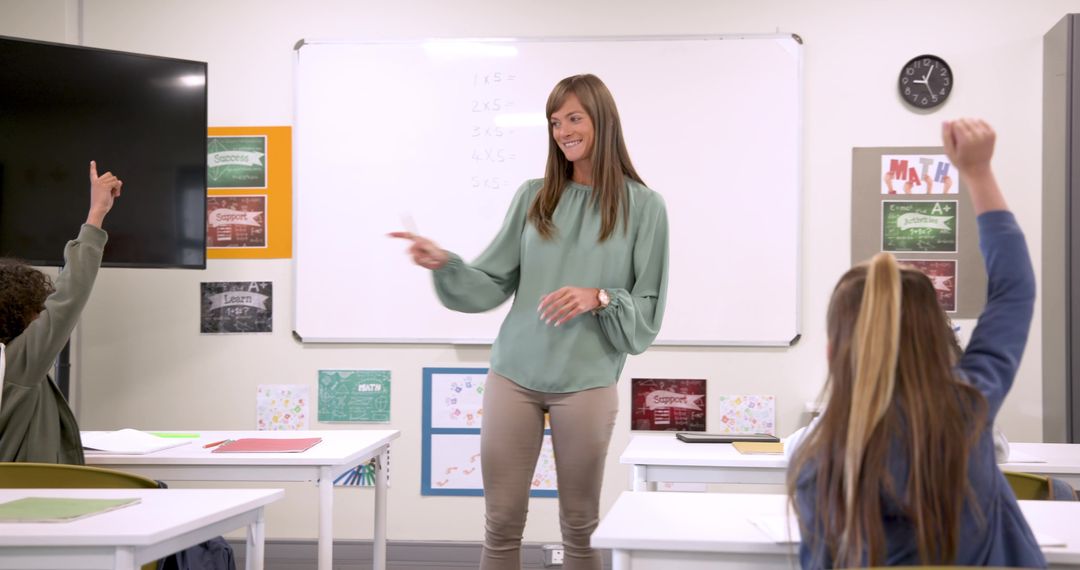 Teacher Engaging Students at Whiteboard in Modern Classroom