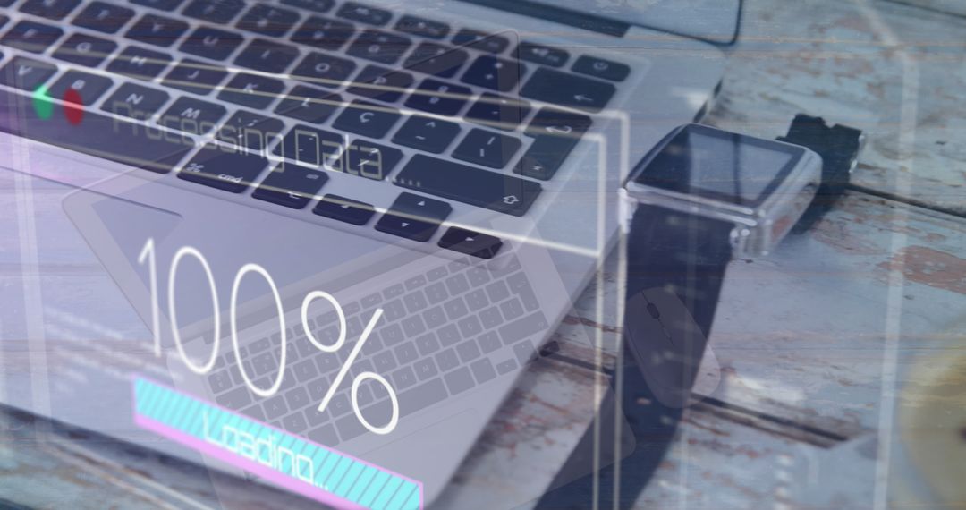 Laptop and Smartwatch Displaying Data Covering Wooden Table