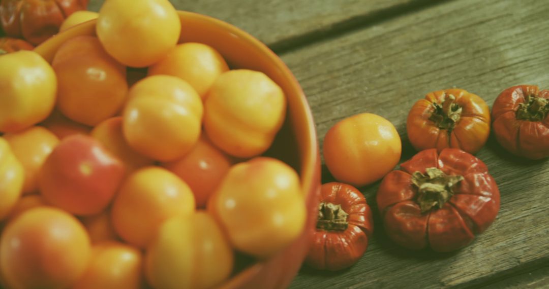 Eco-Friendly Harvest of Yellow and Red Tomatoes on Wooden Surface
