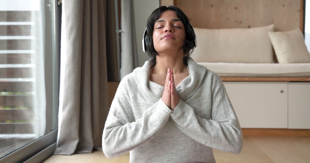 Peaceful Meditation in Cozy Home Setting with Headphones