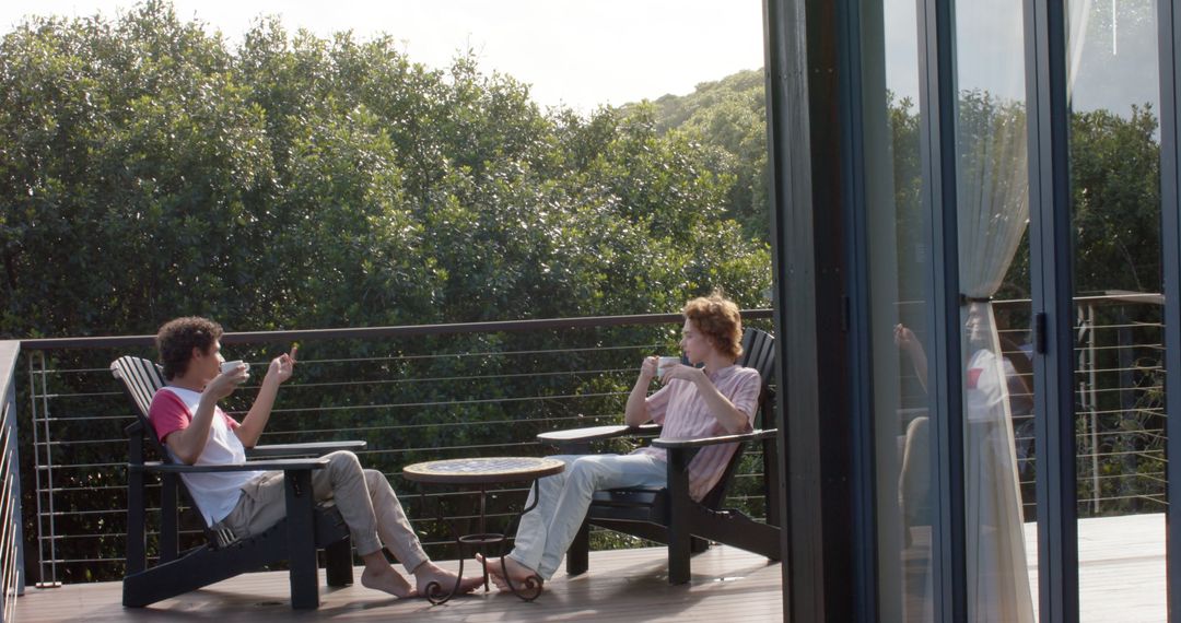 Happy Couple Enjoying Relaxing Coffee on Balcony