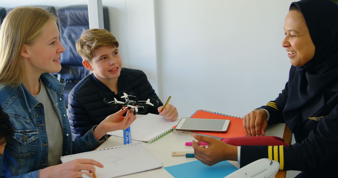 Female Pilot Teach Diverse Students About Aviation Principles - Free Images, Stock Photos and Pictures on Pikwizard.com