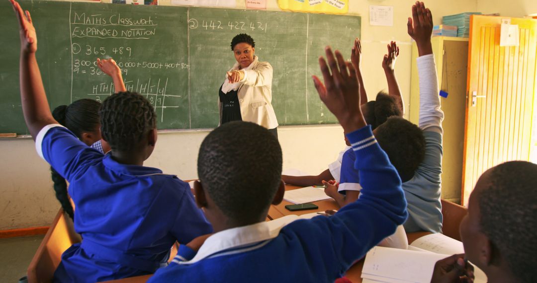 Teacher Engaging with Enthusiastic Students in a Mathematics Class - Free Images, Stock Photos and Pictures on Pikwizard.com