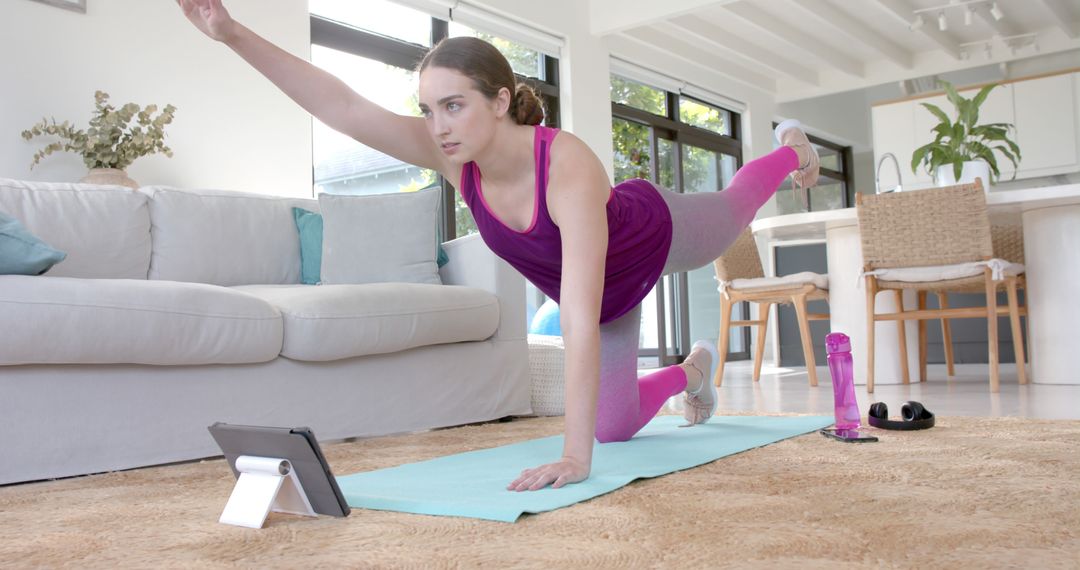 Woman Practicing Yoga at Home Following Online Class on Digital Tablet - Free Images, Stock Photos and Pictures on Pikwizard.com