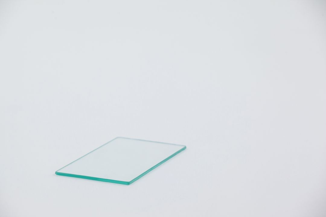 Close-up of sheet of glass on white background - Free Images, Stock Photos and Pictures on Pikwizard.com