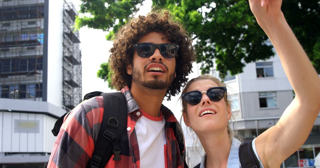 Two Friends Exploring City on Sunny Day