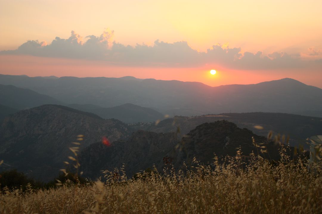 Serene Mountain Sunset over Golden Grasslands - Free Images, Stock Photos and Pictures on Pikwizard.com